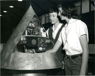 Sandra Tucker and Judy Sesock work with their satellite nose cone prototype project at Jackson Junior High School in 1960.