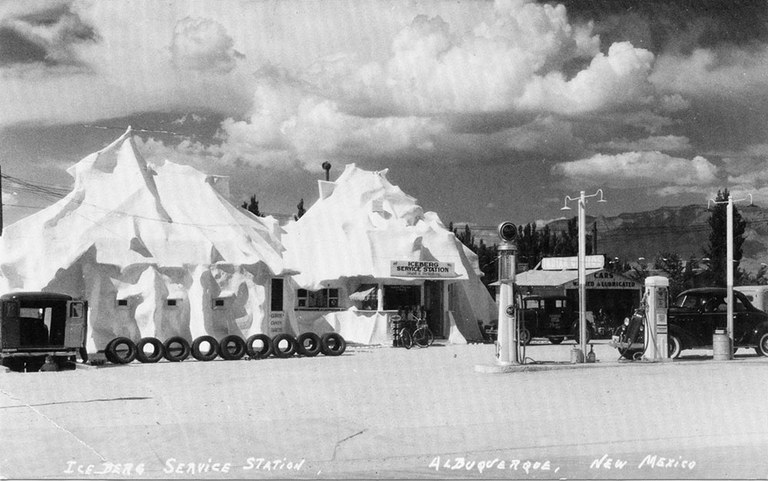 A vintage black and white photo of the Iceberg Cafe, a white building with a lumpy roof meant to emulate snowy hill.