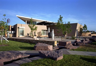 An exterior view of the Albuquerque Museum as seen from the front, taken in part of the sculpture garden area.