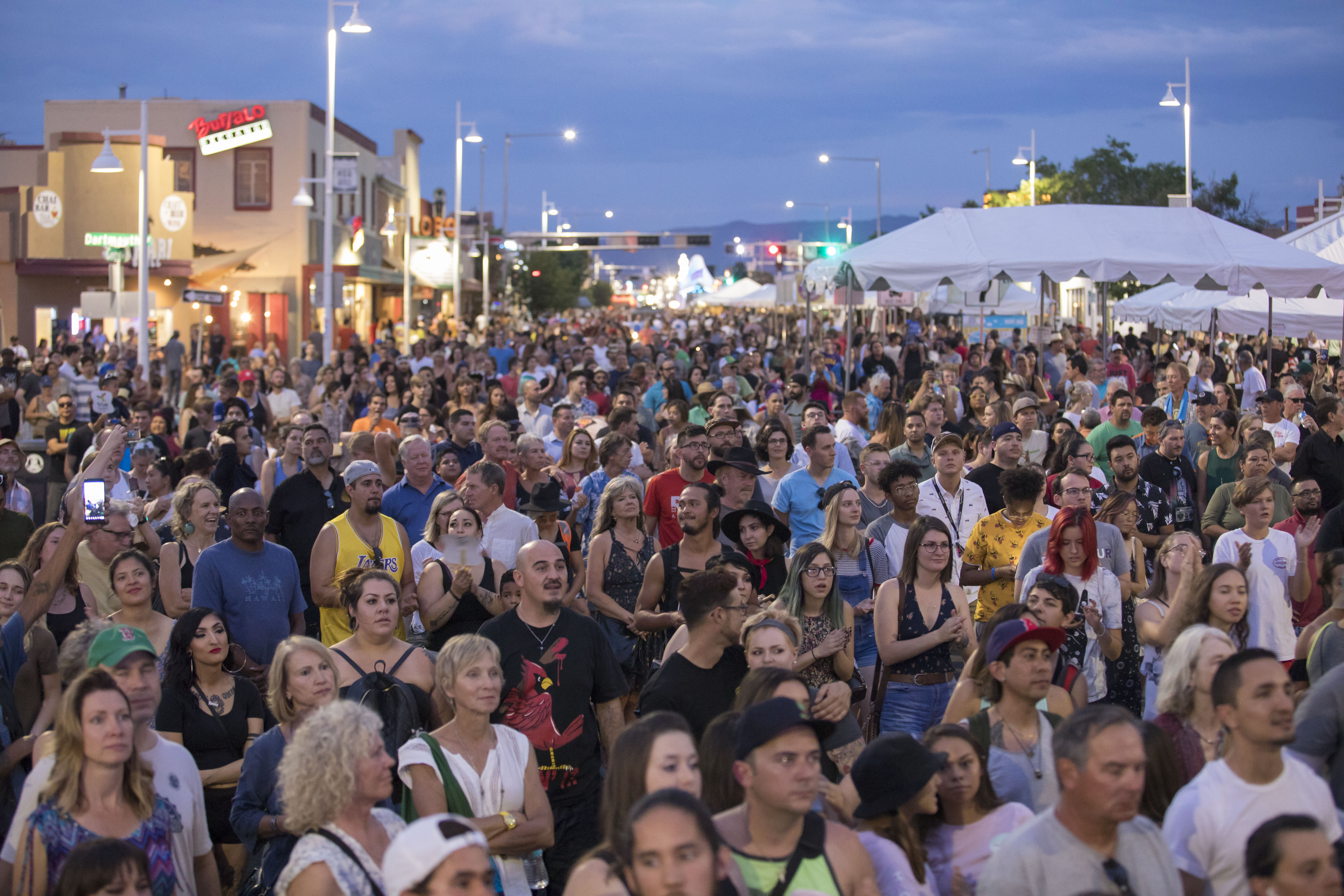 A crowd of people walking along Central during Summerfest.