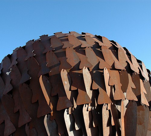 Top portion of a large, globe sculpture created using 600 steel interlocking Rio Grande Cutthroat Trout fish cut-outs.