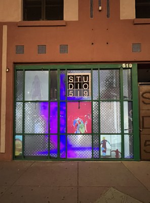 Window installation with multiple video screens displaying video art.