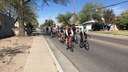 Group Biking Down Street Section Highlight Block