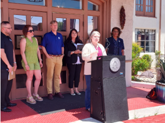 Councilor Fiebelkorn speaks at the ribbon cutting of the new location  for the Unhoused Youth Campus along with, Mayor Tim Keller, and City Councilors Brook Bassan (District 4), and Renée Grout (District 9).. 