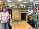 John M Henderson, III and AWA volunteers with dog house donation