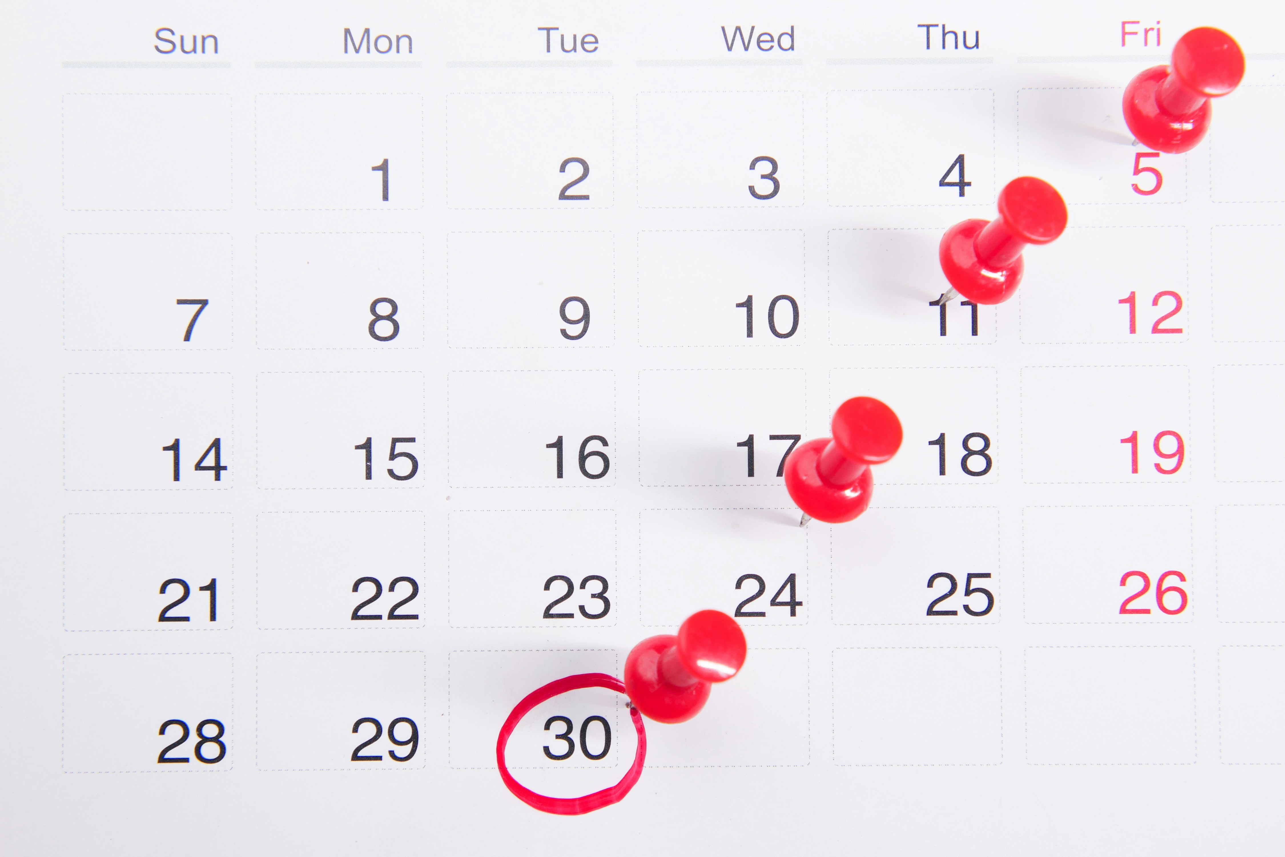 An event calendar marked off in red.