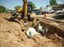 Laying Down Storm Drain on Morris