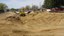 Removing concrete lining east of comanche bridge