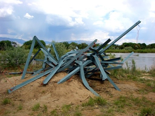 A sculpture that looks like a pile of scrap metal.