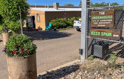 The entrance to the parking lot of the Greenhouse, City of Albuquerque park management division. 8220 Spain Rd NE.