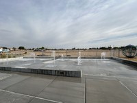 Westgate Spray Pad with multiple geysers spraying upwards.