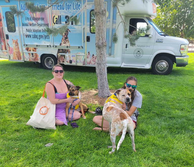 Lucky Paws Van with 2 people sitting with dogs