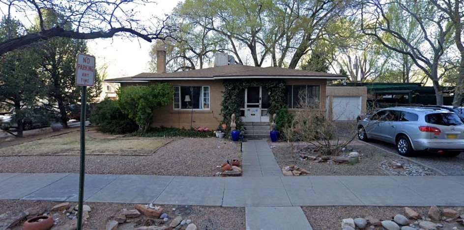 A residential home with a tan exterior.