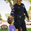 Officer Giving a Sticker to a Child