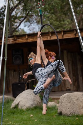 Image of two performers with a large hoop teaching about Albuquerque's water resources. 
